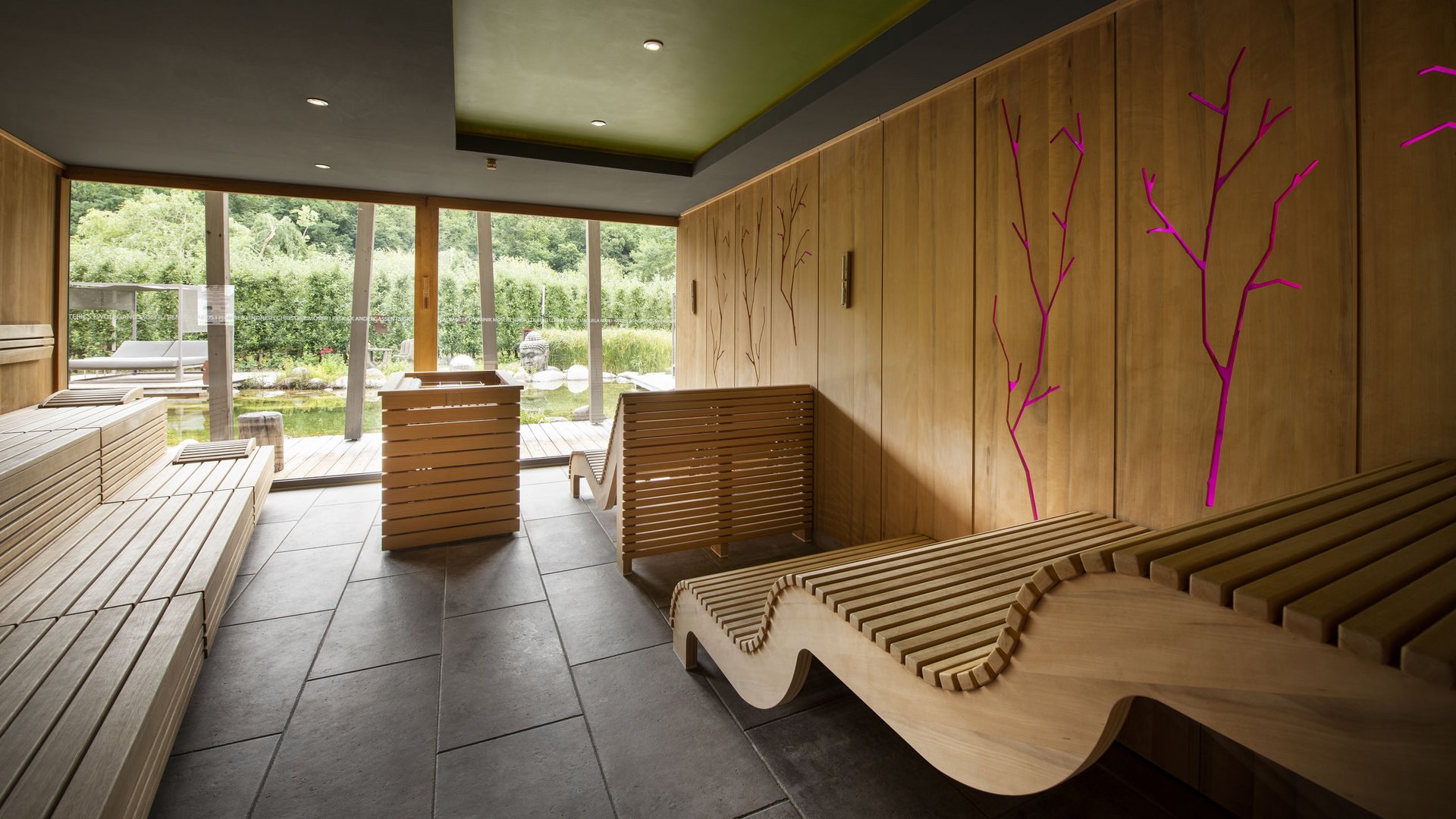 Wellness hotel with whirlpool and sauna world Modern wooden bench sauna room with large windows and garden view