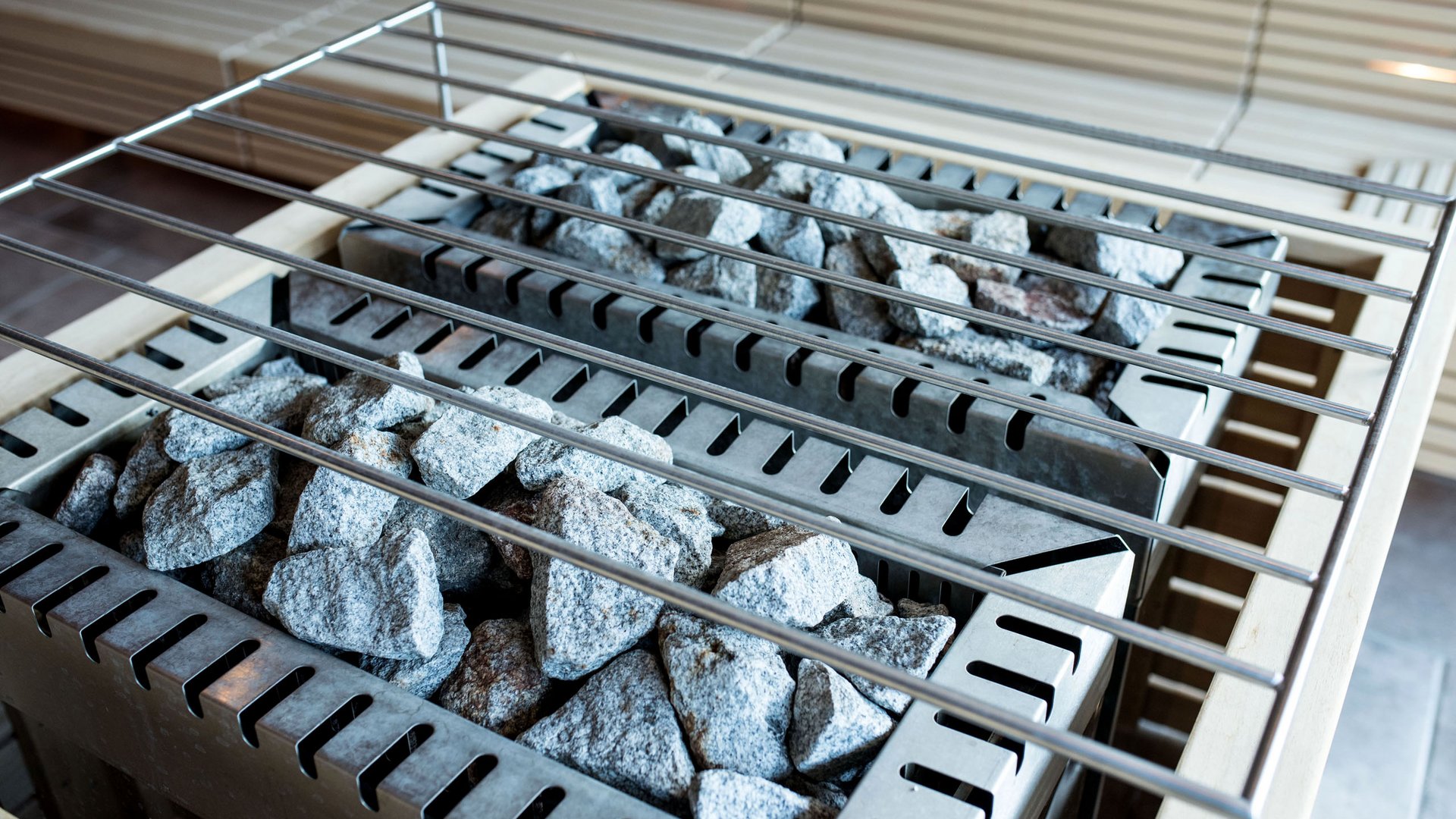 Wellness hotel with whirlpool and sauna world Sauna heater with hot stones and metal grate